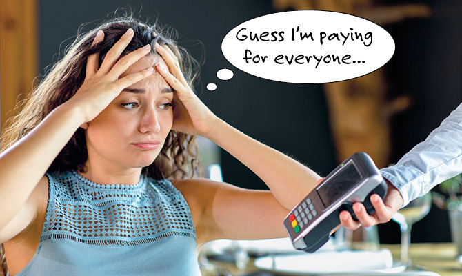 Image of stressed teen looking at a credit card machine thinking, Guess I&apos;m paying for everyone...